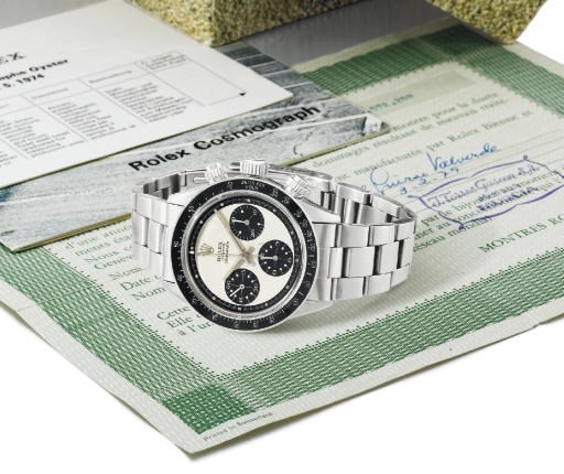 Rolex. A fine and rare stainless steel water-resistant chronograph wristwatch with bracelet, original guarantee and box
