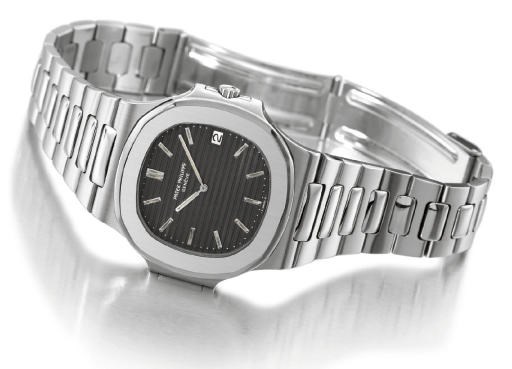Patek Philippe. A large stainless steel self-winding water-resistant wristwatch with date and bracelet