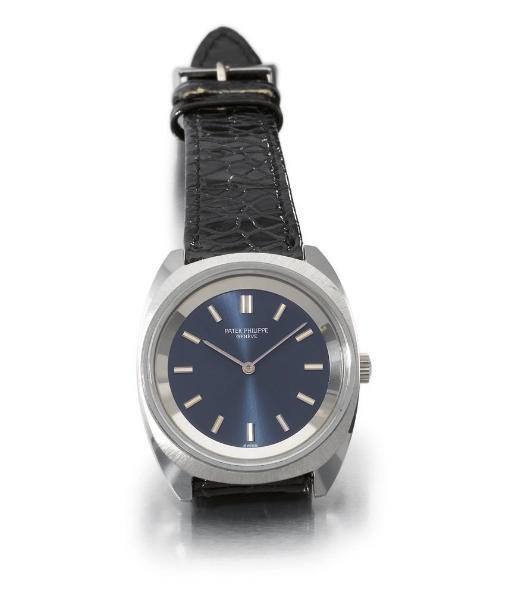 Patek Philippe. An unusual stainless steel tonneau-shaped water-resistant wristwatch