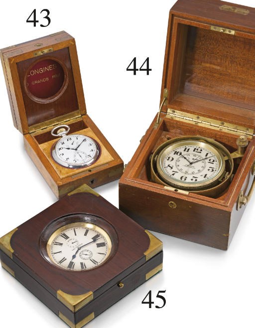 Longines. A gilt brass keyless lever 8-day deck watch with up and down indicator and wooden box