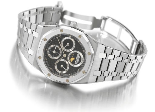 Audemars Piguet. A fine, rare and large stainless steel self-winding water-resistant perpetual calendar wristwatch with phases of the moon, bracelet and platinum bezel