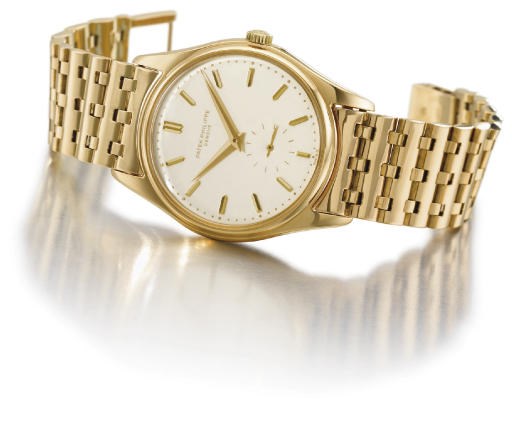 Patek Philippe. A fine and rare 18K gold self-winding water-resistant wristwatch with bracelet, enamel dial and box