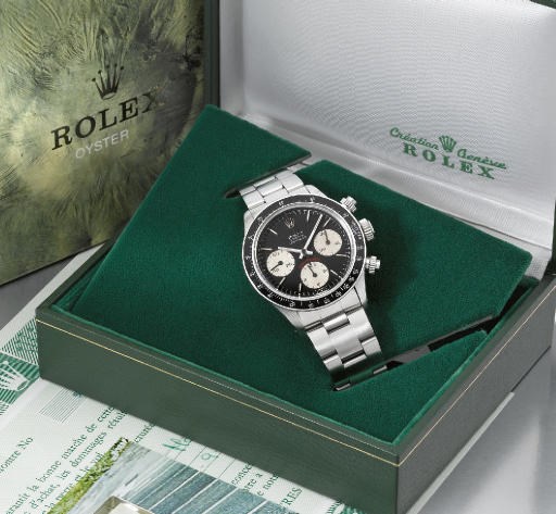 Rolex. A fine and rare stainless steel water-resistant chronograph wristwatch with bracelet, second dial, original guarantee and box
