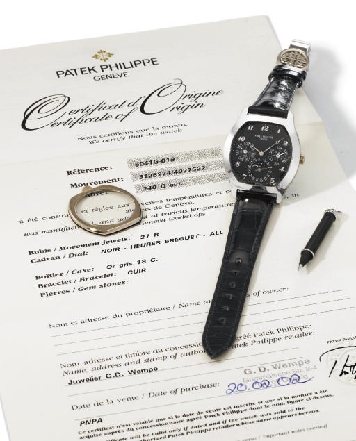 Patek Philippe. An extremely fine and rare 18K white gold self-winding tonneau-shaped perpetual calendar wristwatch with phases of the moon, black dial and Breguet numerals