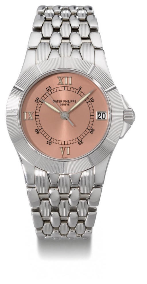 Patek Philippe. A fine stainless steel self-winding water-resistant wristwatch with sweep centre seconds, date, bracelet and champagne dial
