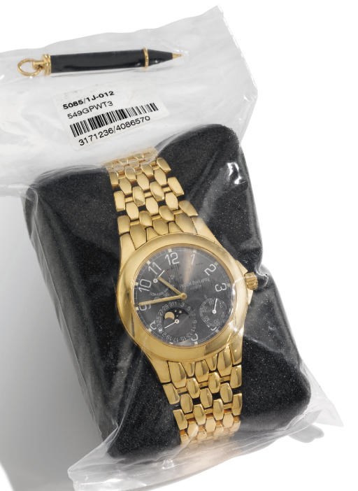 Patek Philippe. A fine and rare 18K gold limited series self-winding wristwatch with date, power reserve, phases of the moon, bracelet, black dial and original certificate