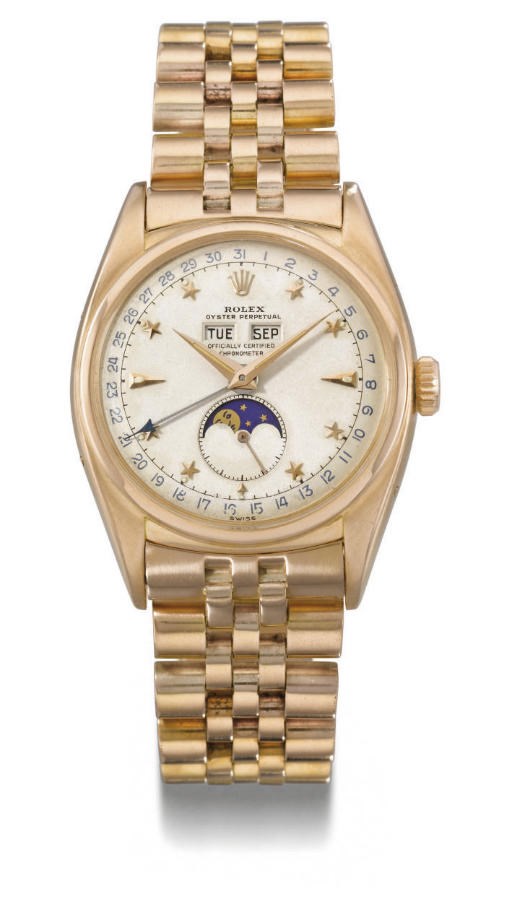 Rolex. A very fine and extremely rare 18K pink gold self-winding water-resistant triple calendar wristwatch with phases of the moon, bracelet and star dial