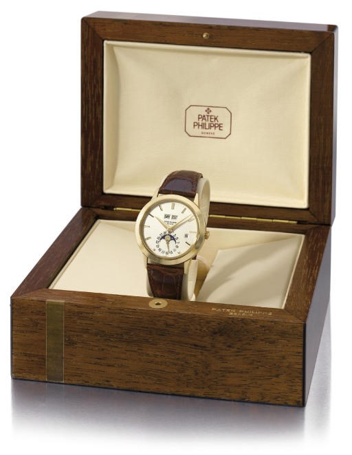 Patek Philippe. A very fine and rare 18K gold self-winding perpetual calendar wristwatch with phases of the moon and leap year indicator