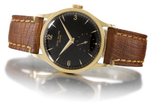 Patek Philippe. A very attractive, rare and large 18K gold wristwatch with black dial and anti-magnetic movement