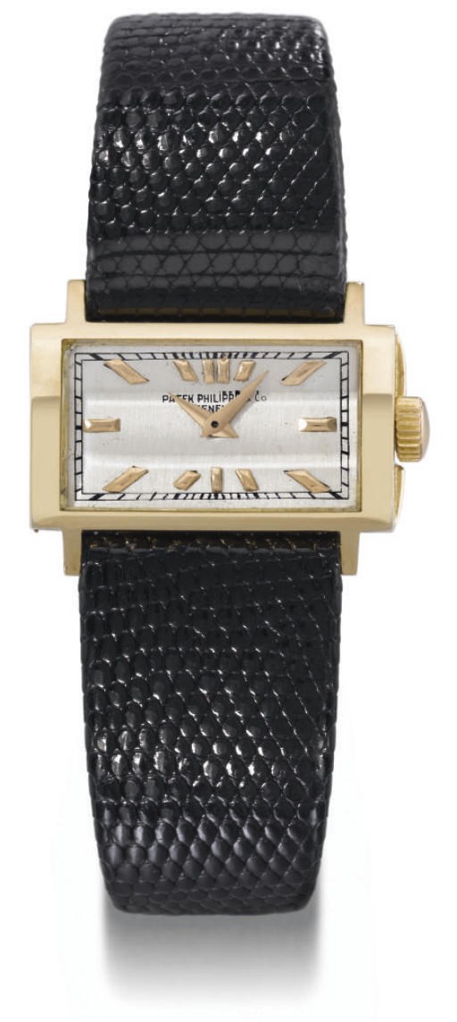 Patek Philippe. A fine, rare and unusual 18K gold rectangular hinged driver's wristwatch