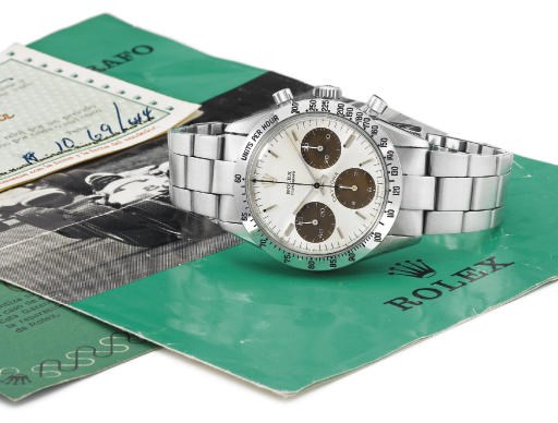 Rolex. A fine stainless steel chronograph wristwatch with bracelet, brown-coloured subsidiary seconds dial and original guarantees