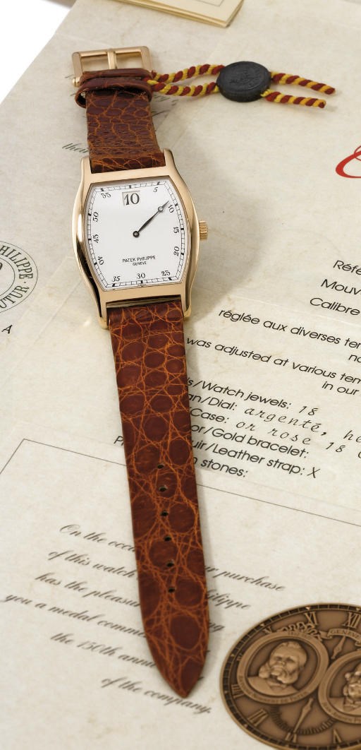 Patek Philippe. A very fine and rare 18K pink gold limited edition tonneau-shaped jump hour wristwatch with original certificate