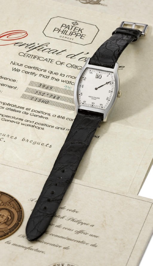Patek Philippe. A very fine and rare platinum limited edition tonneau-shaped jump hour wristwatch