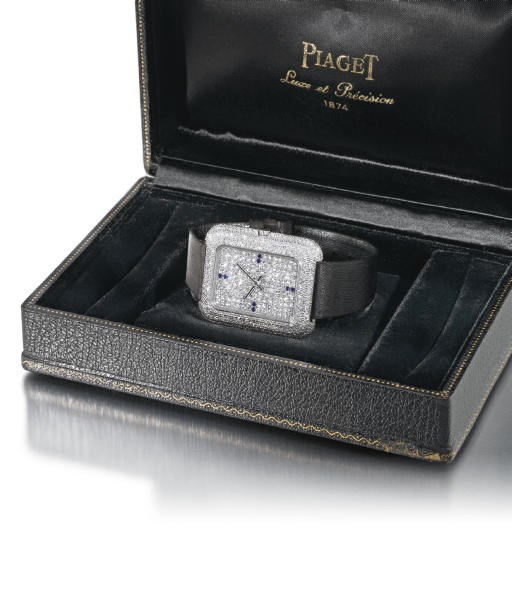 Piaget. A fine, large and unusual 18K white gold, diamond and sapphire-set rectangular wristwatch with box