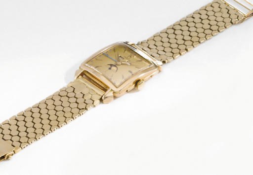 Omega. A fine 18K gold square-shaped full calendar wristwatch with phases of the moon and champagne dial