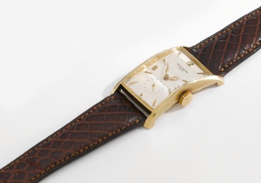 Patek Philippe. A fine 18K gold rectangular wristwatch