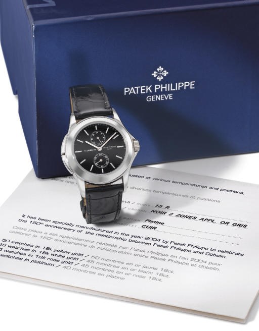 Patek Philippe. A very fine and rare platinum limited edition water-resistant dual time wristwatch with black dial, made for the 150th anniversary of Gübelin
