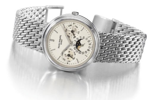 Patek Philippe. A fine 18K white gold self-winding perpetual calendar wristwatch with phases of the moon and bracelet
