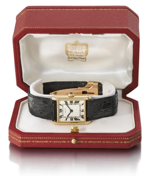 Cartier. A fine 18K gold rectangular wristwatch with box