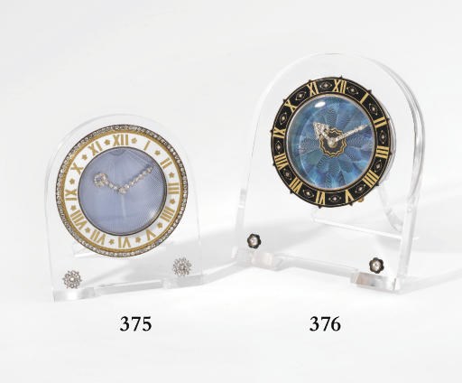 Cartier. A very fine and rare 18K gold, rock crystal, enamel and diamond-set 8-day "borne" desk timepiece with strut and kingfisher feather dial
