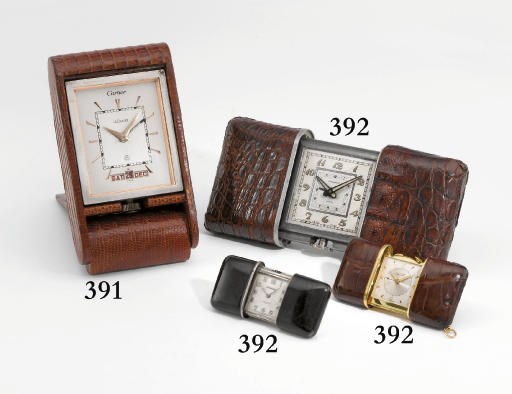 Cartier. An unusual stainless steel and leather hinged 8-day triple calendar bedside timepiece with alarm and two-tone silvered dial