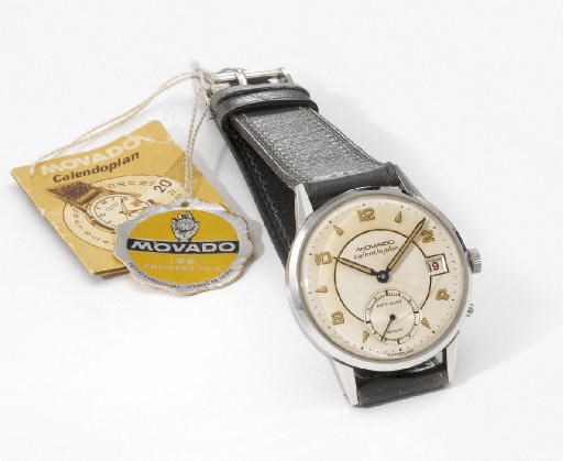Movado. A stainless steel wristwatch with date, two-tone silvered dial and original sales tags