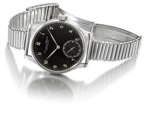 IWC. A very fine and rare stainless steel oversized wristwatch with black dial and Gay Freres bracelet