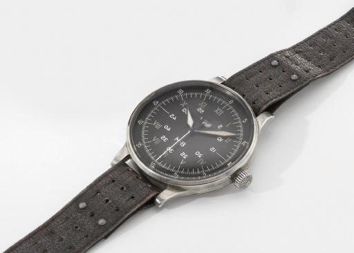 A. Lange & Söhne. An extremely rare and large silver prototype aviator's wristwatch with sweep centre seconds, hack feature and black dial