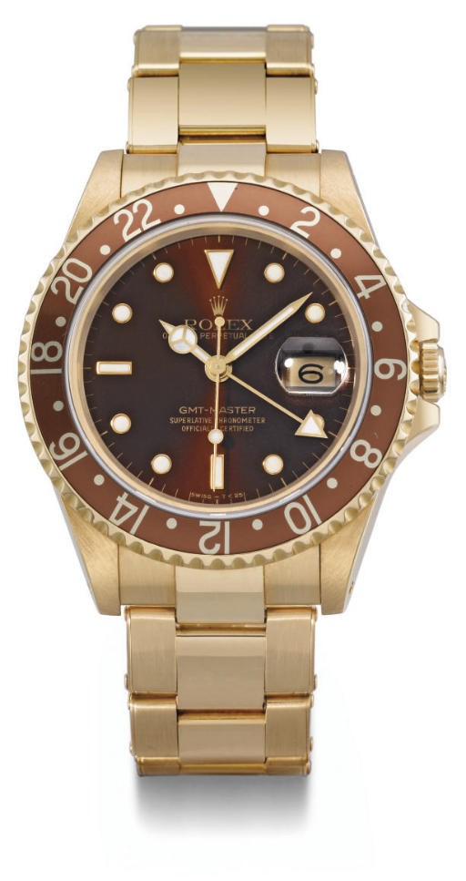 Rolex. An 18K gold self-winding water-resistant dual time wristwatch with sweep centre seconds, date and bracelet