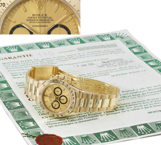 Rolex. An 18K gold water-resistant chronograph wristwatch with bracelet and original guarantee