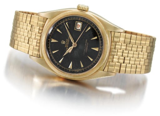 Rolex. A fine and rare 18K gold self-winding water-resistant wristwatch with sweep centre seconds, date, black dial and bracelet