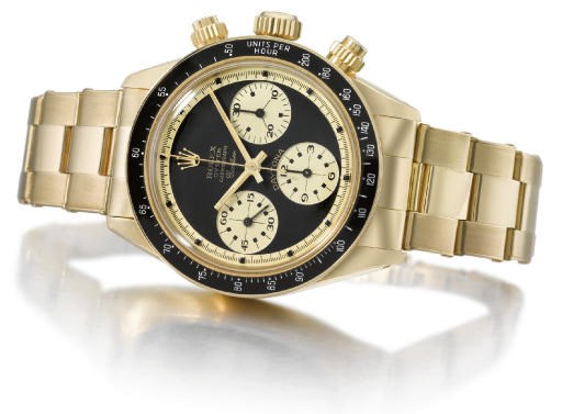 Rolex. An 18K gold water-resistant chronograph wristwatch with bracelet