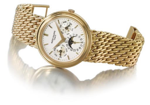 Patek Philippe. A fine 18K gold self-winding perpetual calendar wristwatch with phases of the moon and bracelet