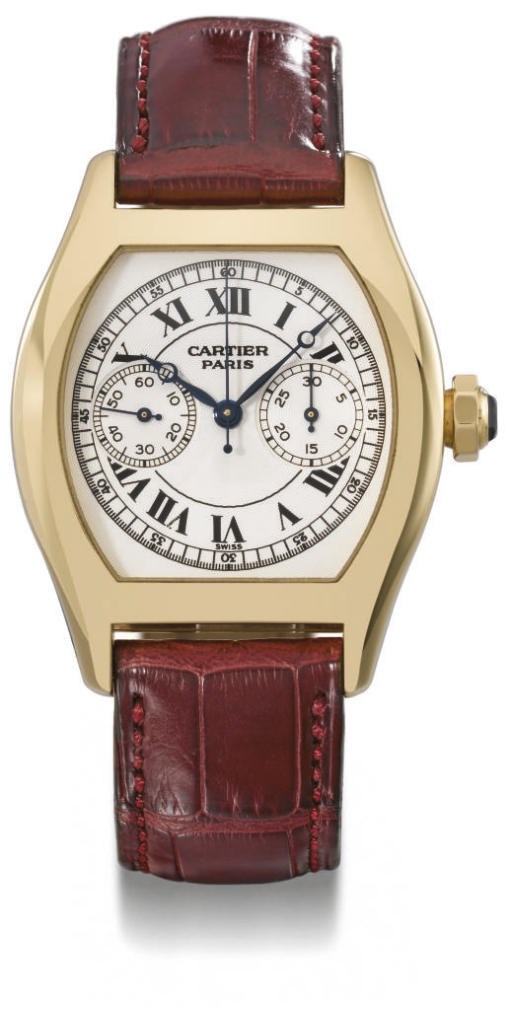 Cartier. A fine 18K gold tonneau-shaped single button chronograph wristwatch