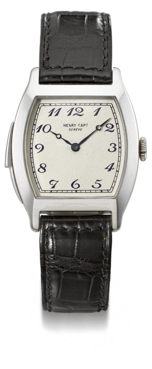 Capt. An extremely fine and rare 18K white gold tonneau-shaped minute repeating wristwatch with Breguet numerals
