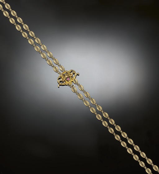 A late 19th century French gold guard chain with slide