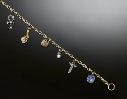 A late 19th/early 20th century gemset charm bracelet