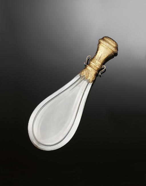 An early 20th century gold and glass scent bottle