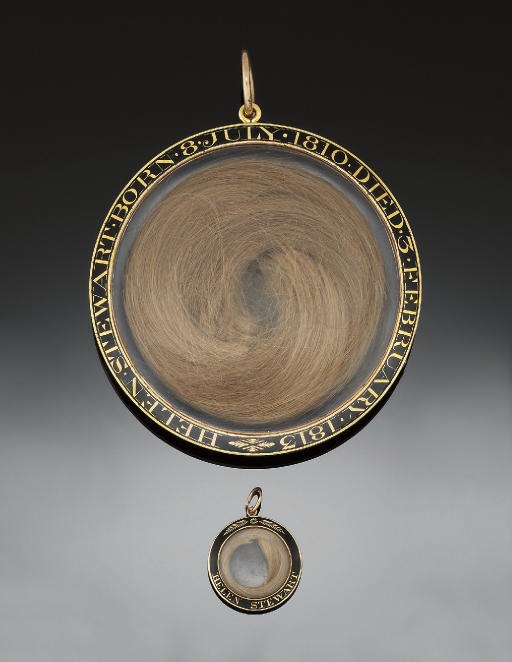 TWO EARLY 19TH CENTURY GOLD AND ENAMEL MOURNING PENDANTS