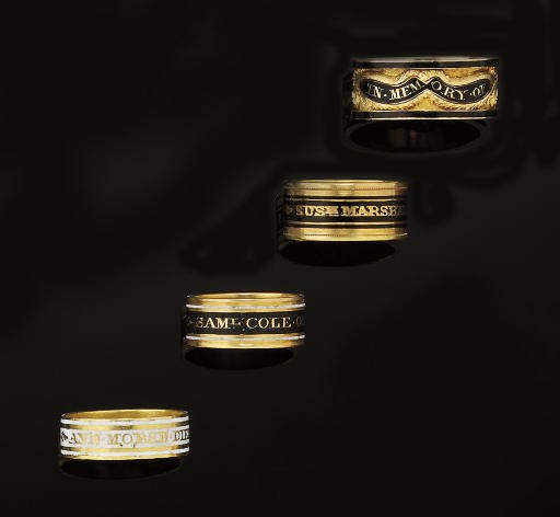 FOUR LATE 19TH/EARLY 20TH CENTURY GOLD AND ENAMEL MOURNING RINGS