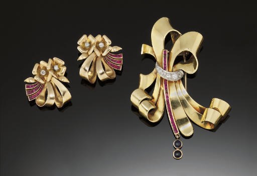 A gold, ruby, diamond and sapphire brooch and two pairs of earclips