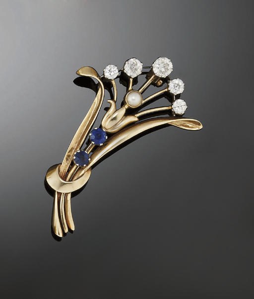 A sapphire and diamond spray brooch