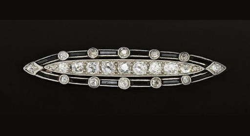 AN ART DECO DIAMOND AND ONYX BROOCH