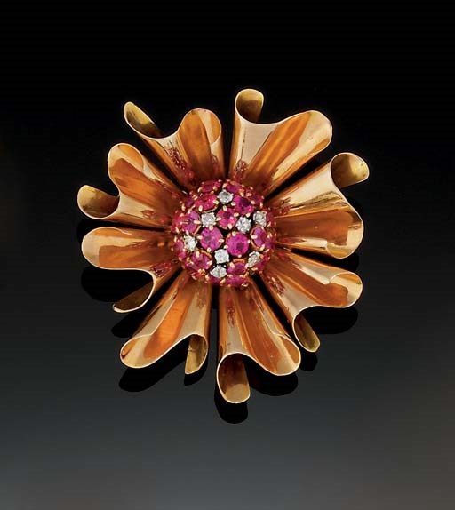 A gold, ruby and diamond brooch
