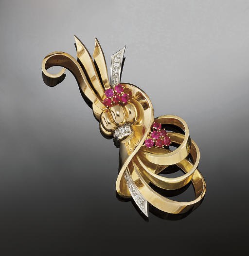 A gold, diamond and ruby brooch