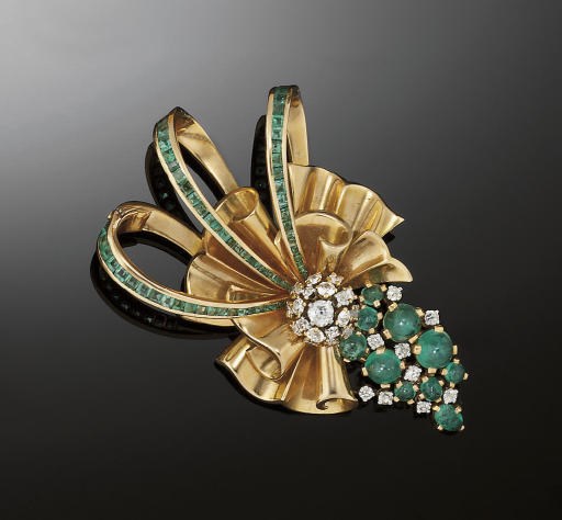 A gold, emerald and diamond brooch