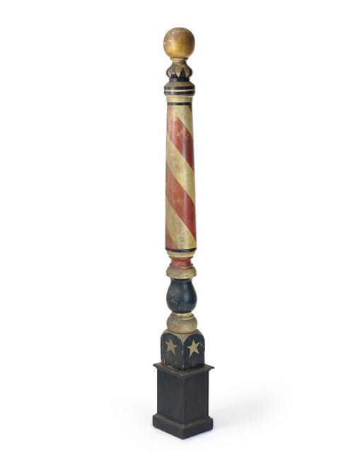 A CARVED AND PAINTED BARBER POLE