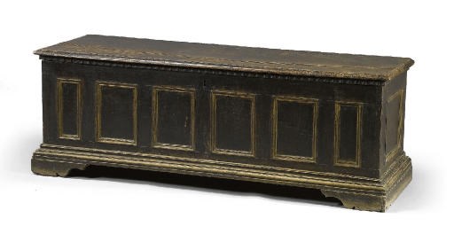 AN ITALIAN WALNUT AND PARCEL-GILT CASSONE