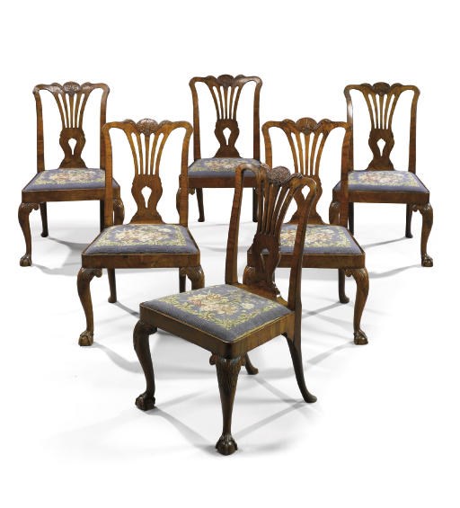 A SET OF SIX IRISH GEORGE II WALNUT DINING CHAIRS