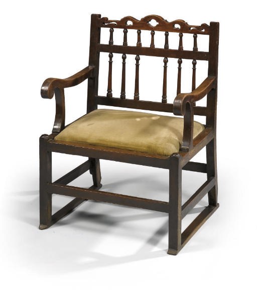 A GEORGE III WALNUT ARMCHAIR